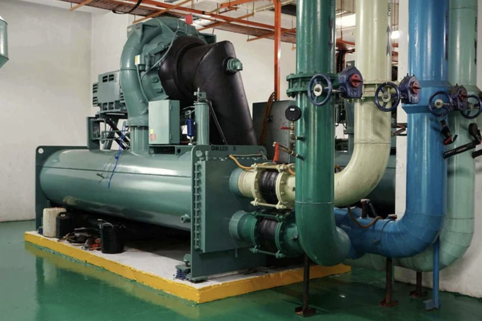 Industrial chiller and pipework in a plant room